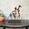 Children Riding a Bicycle Sculpture