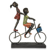 Children Riding a Bicycle Sculpture