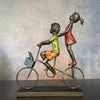 Children Riding a Bicycle Sculpture