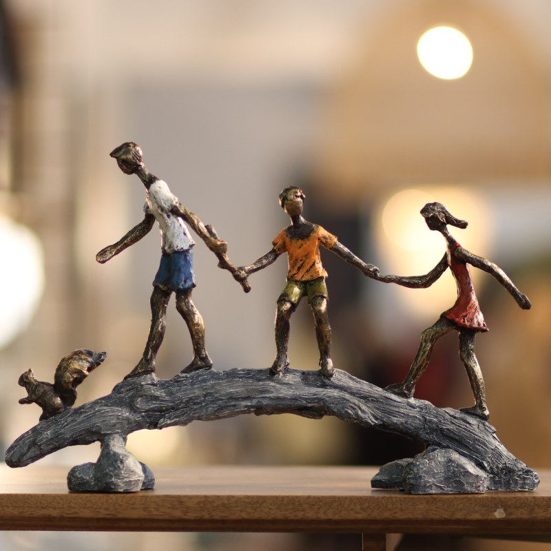 Whimsical Children Crossing Bridge Sculpture