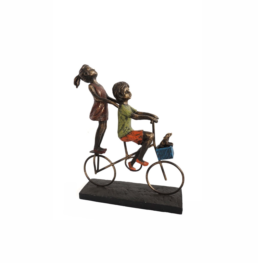 Children Riding a Bicycle Sculpture
