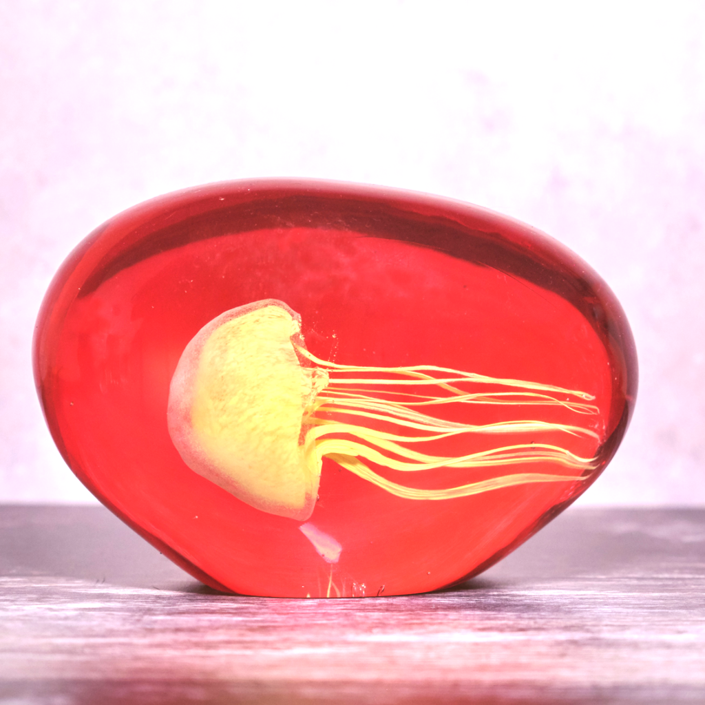 Yellow Jellyfish in Red Glass Ornament